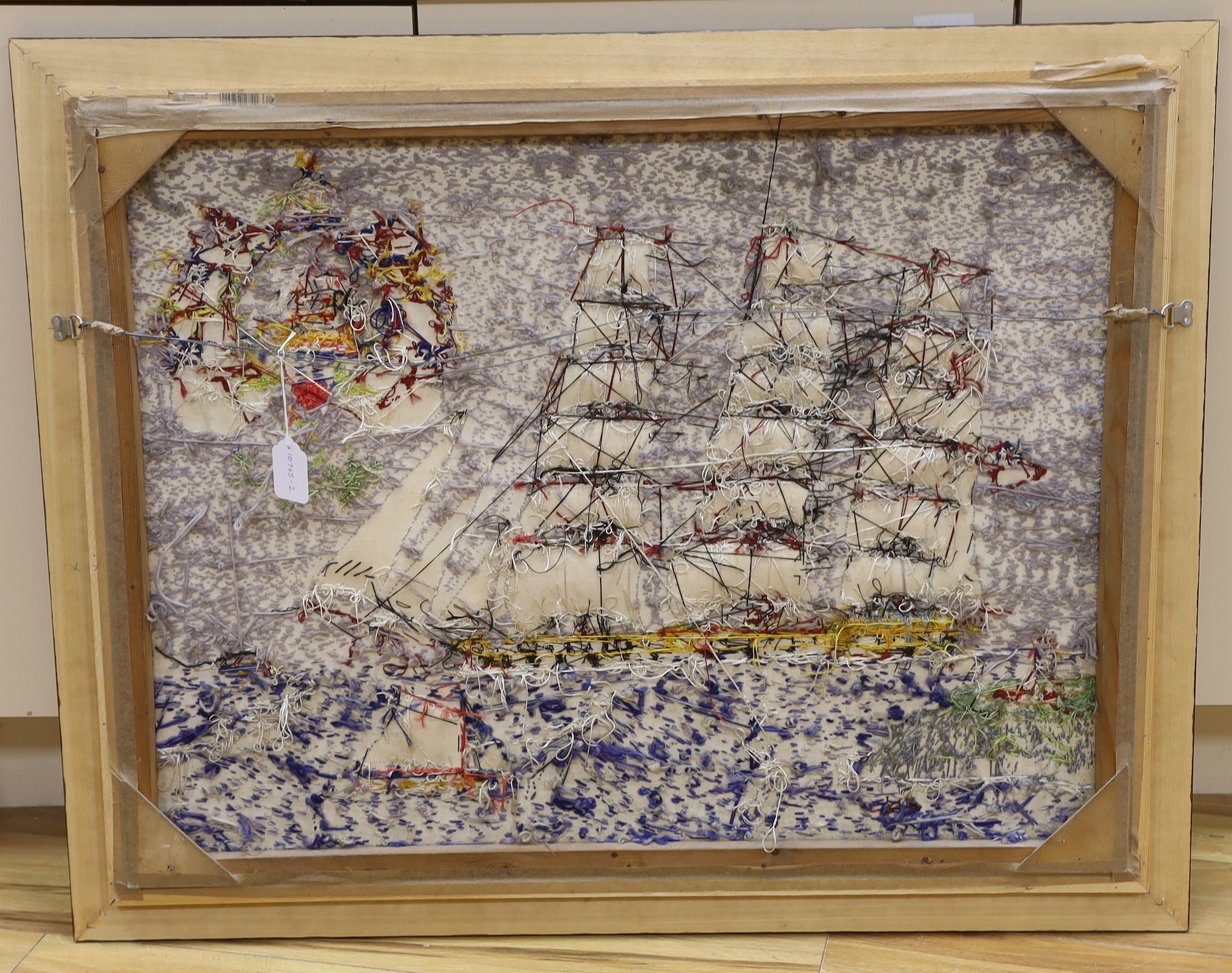 A large framed Victorian woolwork study of a ship, 79x100cm including frame
